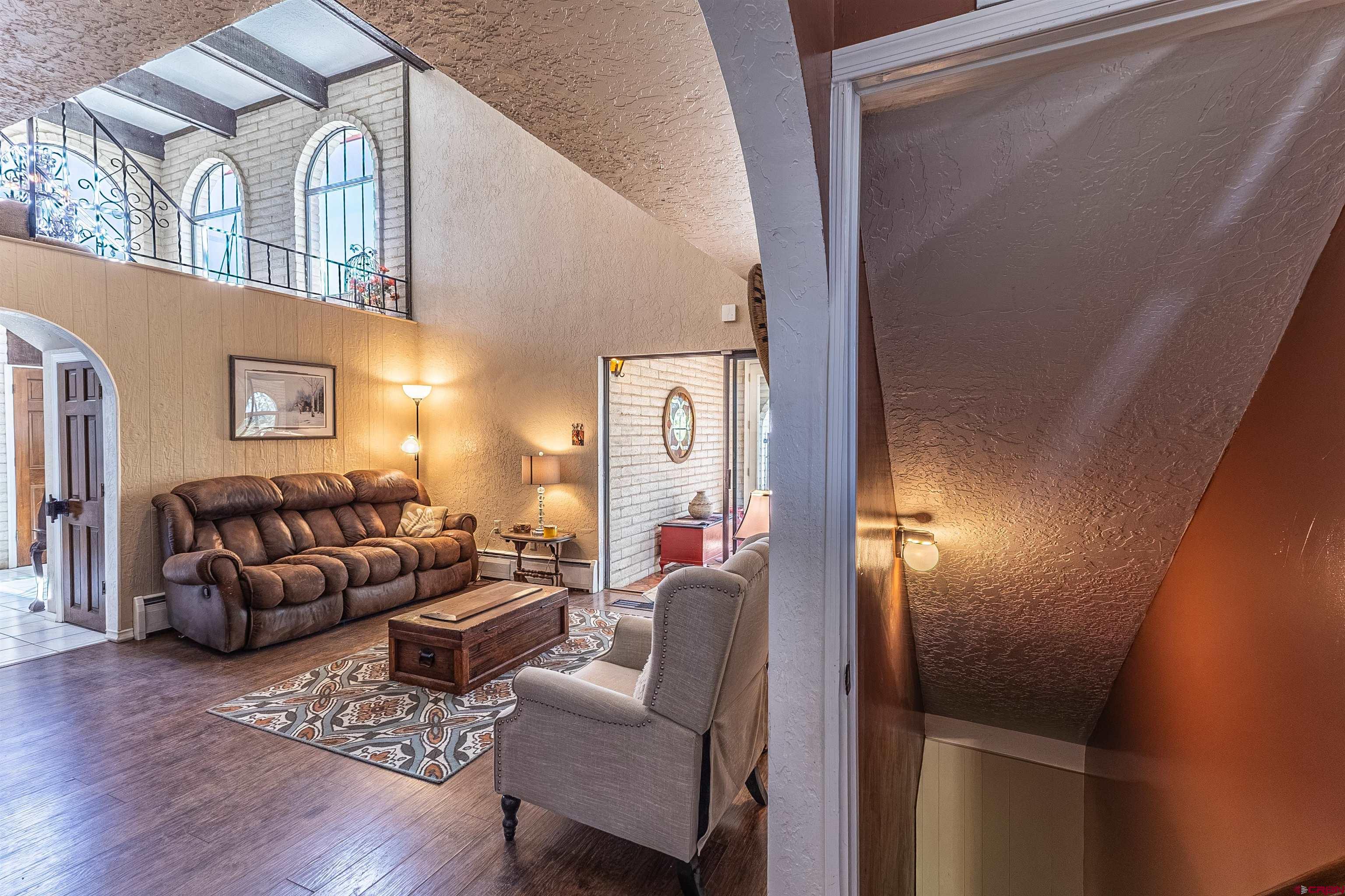 5510 Rinconada Street Farmington, NM 87402 - Photo 24 of 45 a living room with furniture and a fireplace
