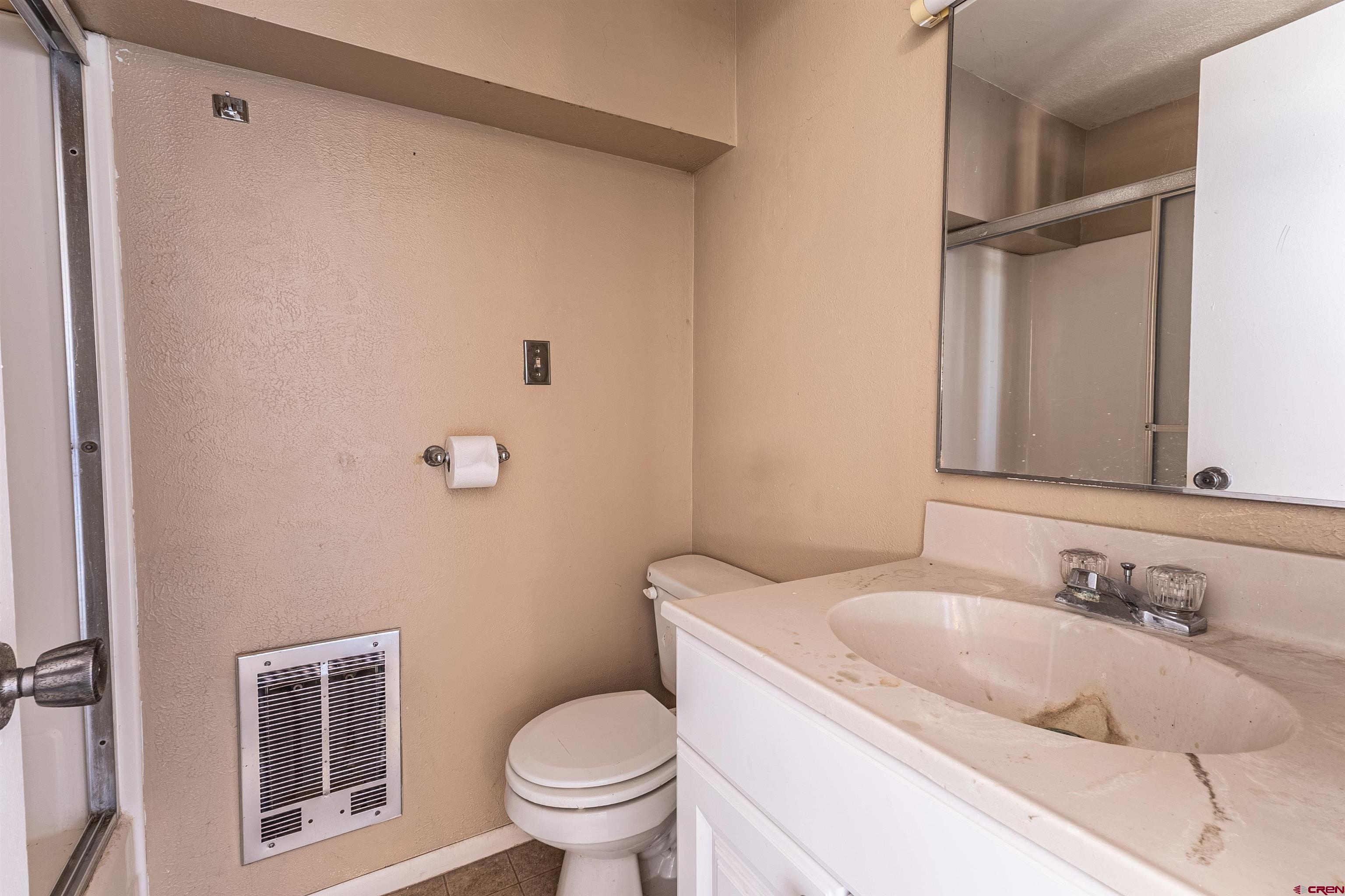 5510 Rinconada Street Farmington, NM 87402 - Photo 27 of 45 a bathroom with a sink toilet and vanity