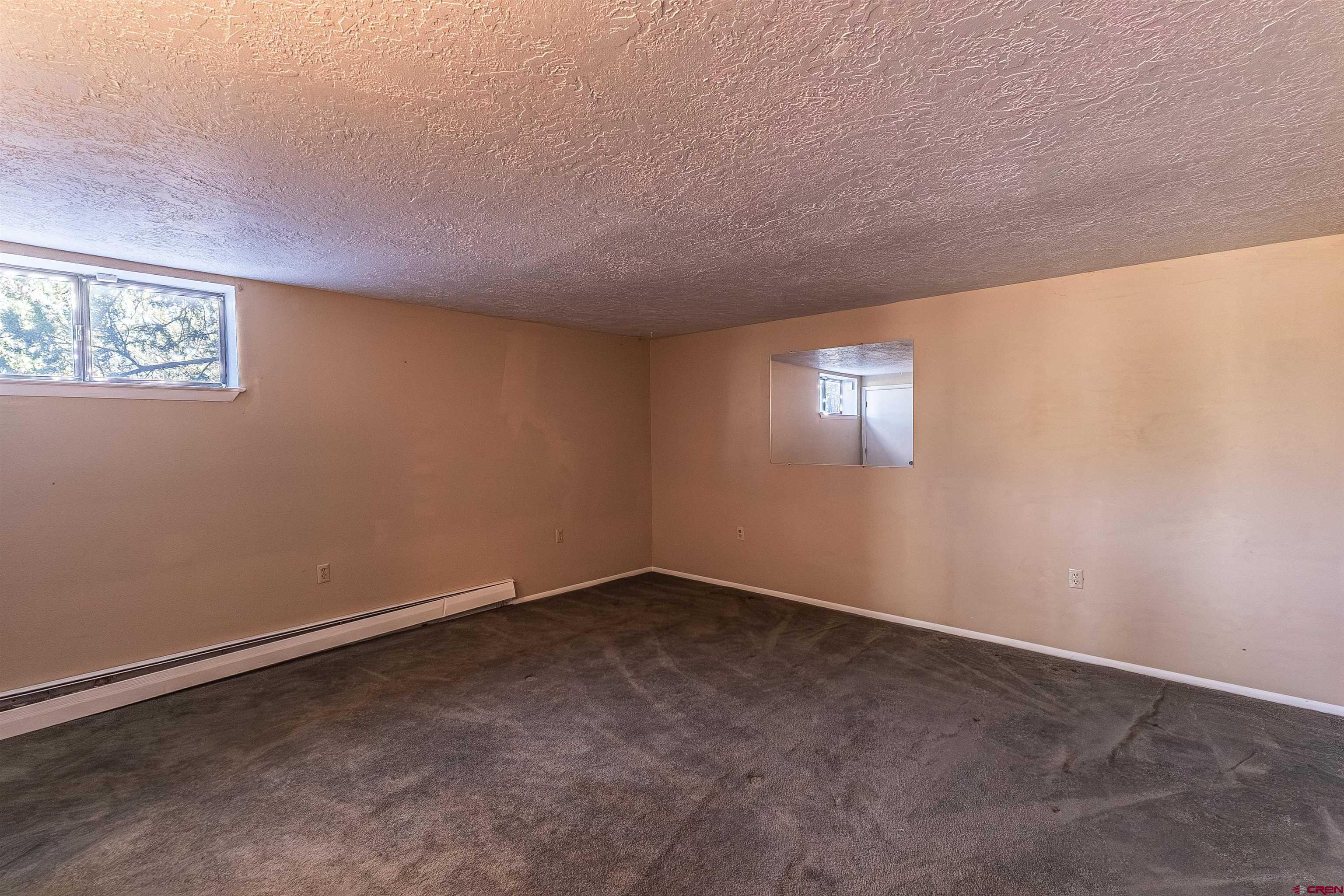 5510 Rinconada Street Farmington, NM 87402 - Photo 29 of 45 an empty room with windows