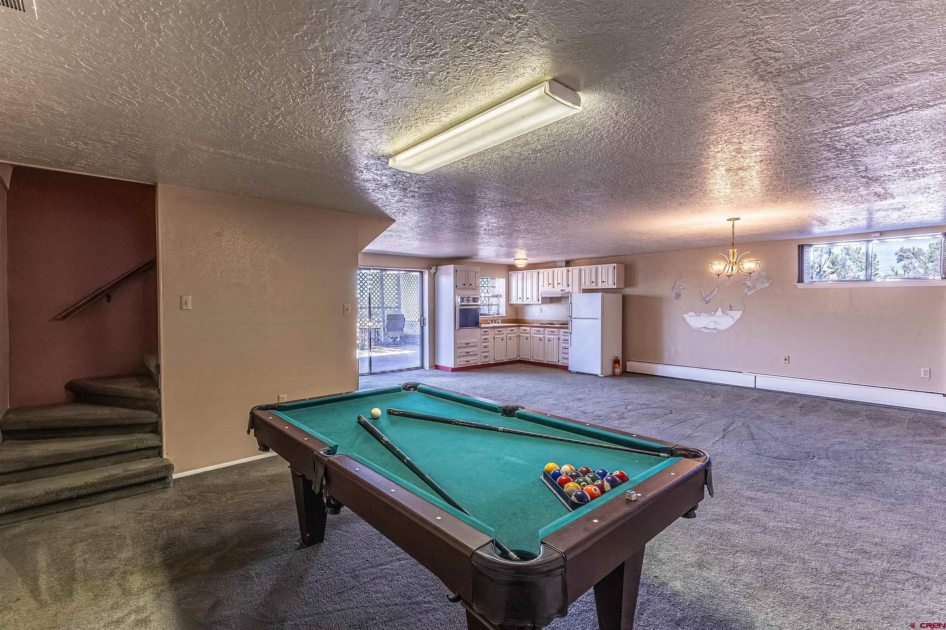 5510 Rinconada Street Farmington, NM 87402 - Photo 31 of 45 a room with pool table and windows