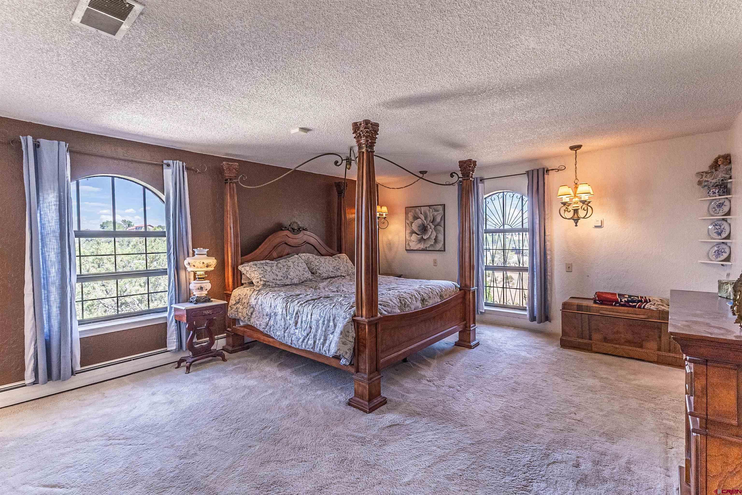 5510 Rinconada Street Farmington, NM 87402 - Photo 36 of 45 a bedroom with a bed and a window