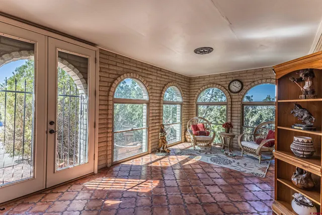 a very nice looking room with large windows