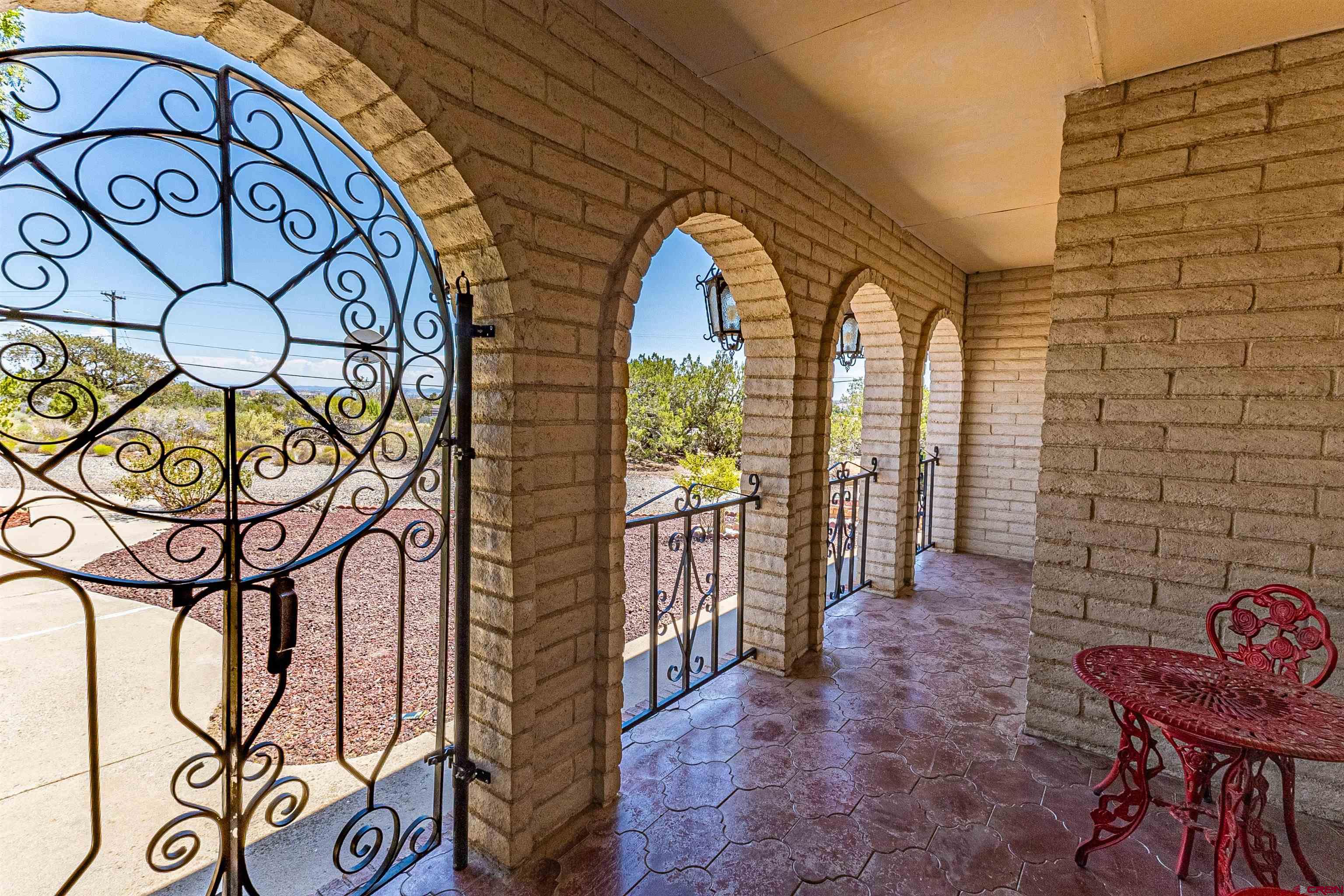 5510 Rinconada Street Farmington, NM 87402 - Photo 45 of 45 a view of a door with a bench and potted plants