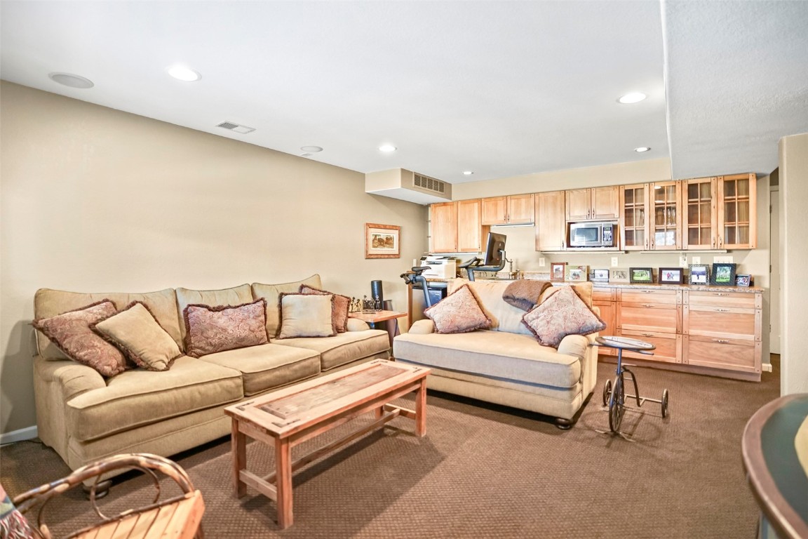 468 South Hillside Drive Silverthorne, CO 80498 - Photo 13 of 34 a living room with furniture and a table