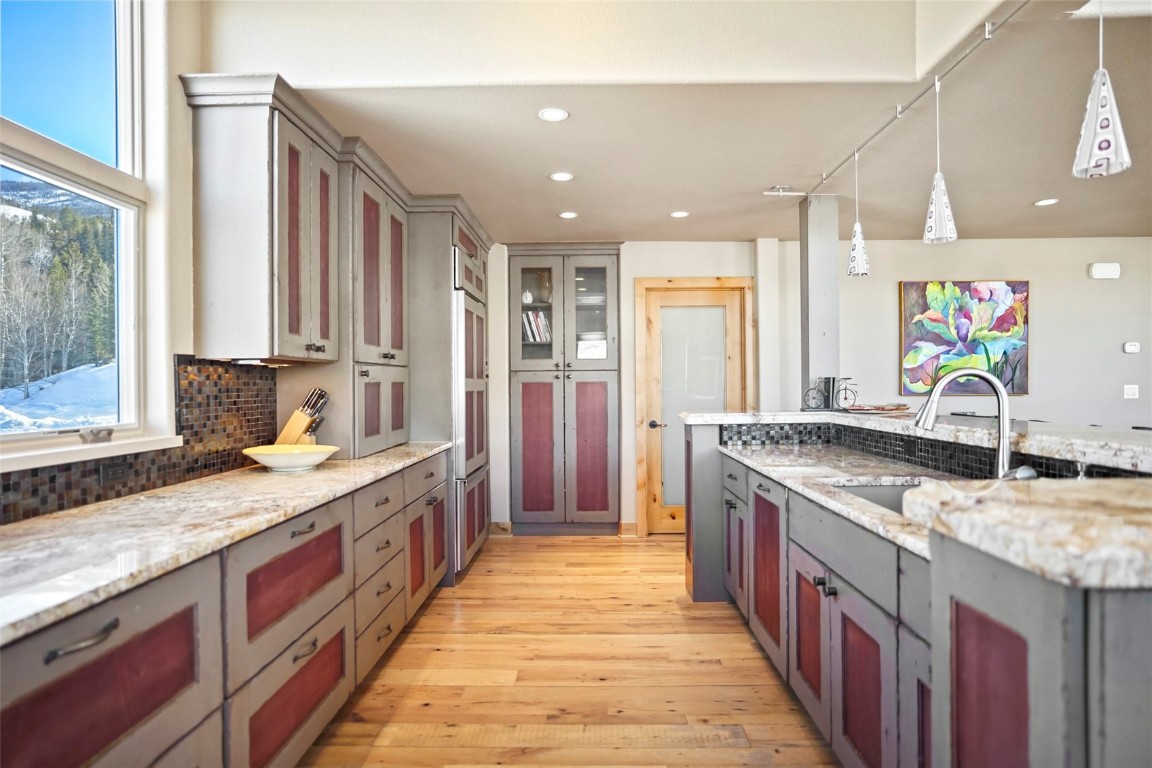 468 South Hillside Drive Silverthorne, CO 80498 - Photo 17 of 34 a large kitchen with stainless steel appliances granite countertop a sink and a stove