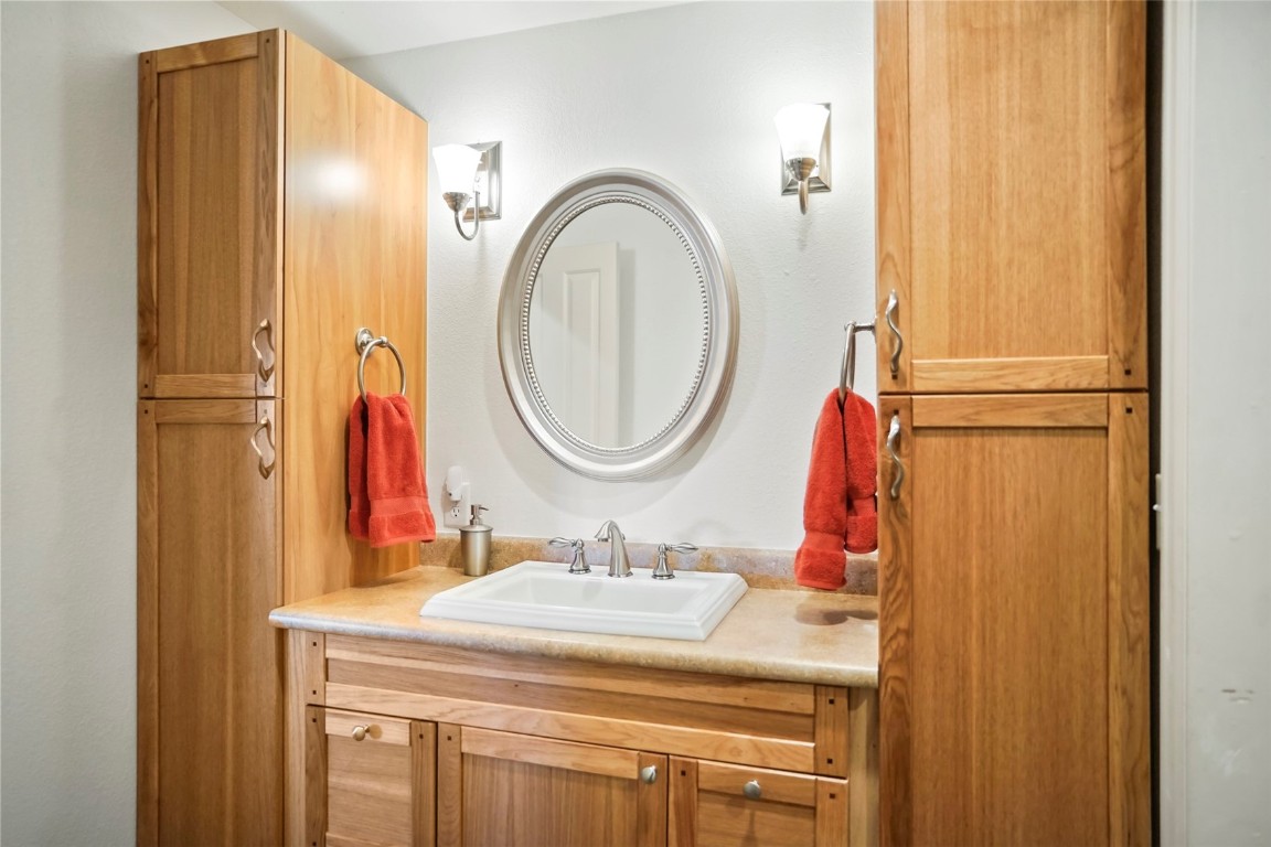 468 South Hillside Drive Silverthorne, CO 80498 - Photo 29 of 34 a bathroom with a sink and a mirror