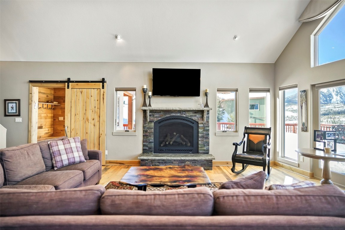 468 South Hillside Drive Silverthorne, CO 80498 - Photo 6 of 34 a living room with furniture fireplace and flat screen tv