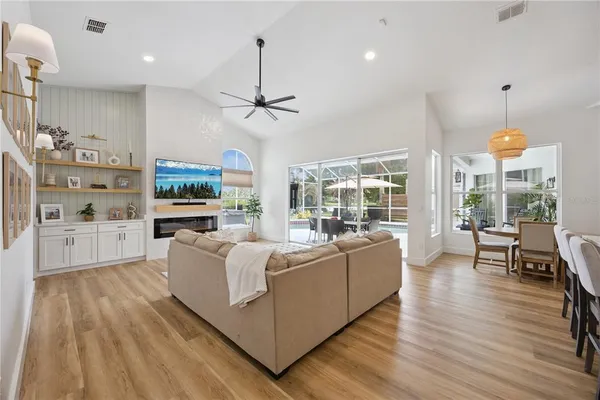 a view of a dining room with furniture and wooden floor
