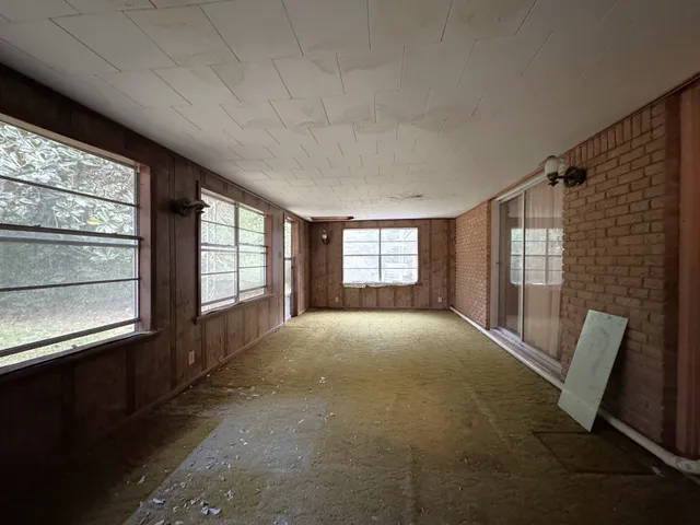 a view of a backyard with large trees
