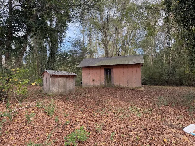 a backyard of a house with lots of green space