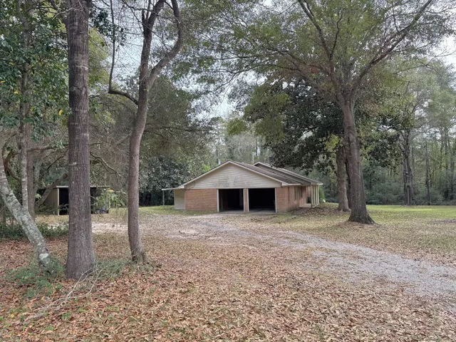 a house with trees in front of it