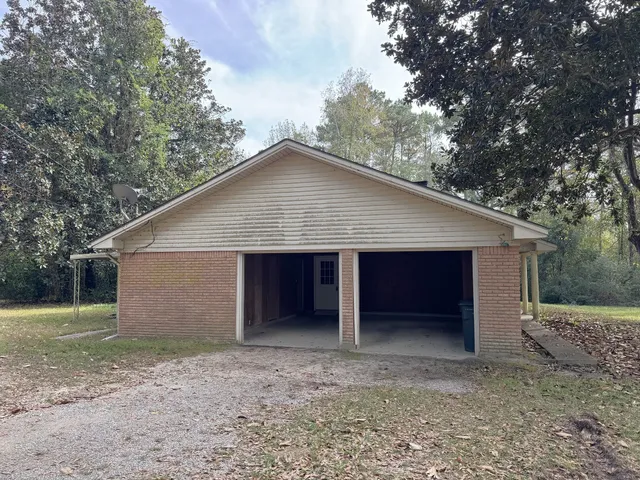 a view of a yard with a tree