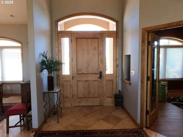 a view of hallway with livingroom and furniture