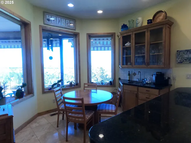 a view of a dining room with furniture window and outside view