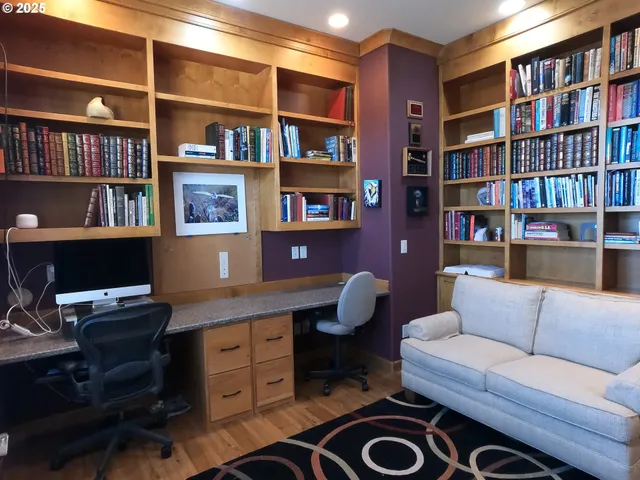 a view of a workspace with bookshelf