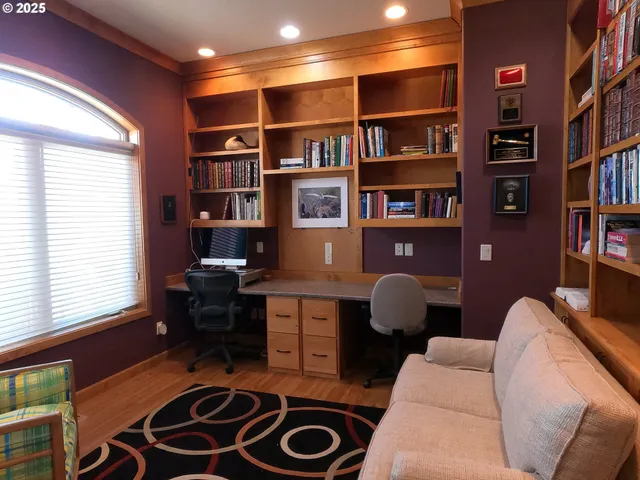 a workspace with furniture and a bookshelf