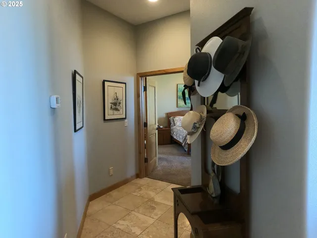 a living room with furniture and a mirror