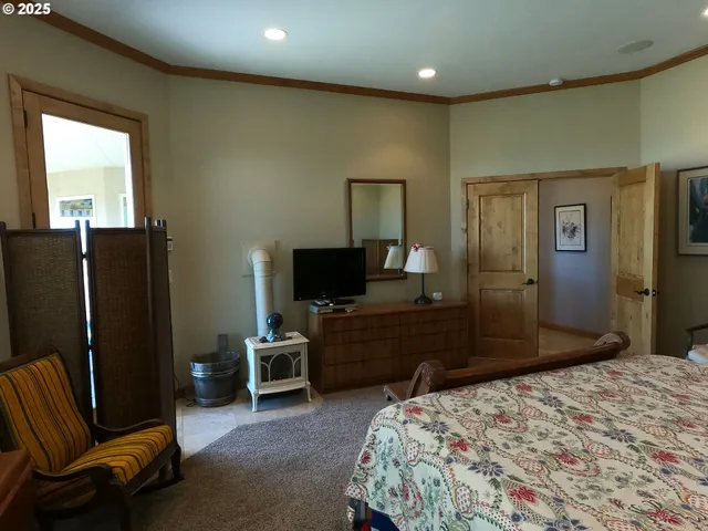 a bedroom with a bed and furniture