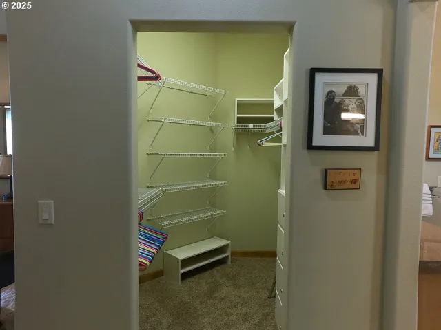 a bathroom with a granite countertop sink toilet and mirror