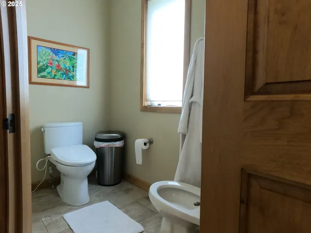 a livingroom with workspace and a couch