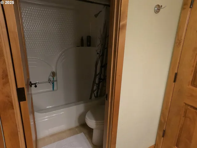 a bedroom with a bed and a television in it