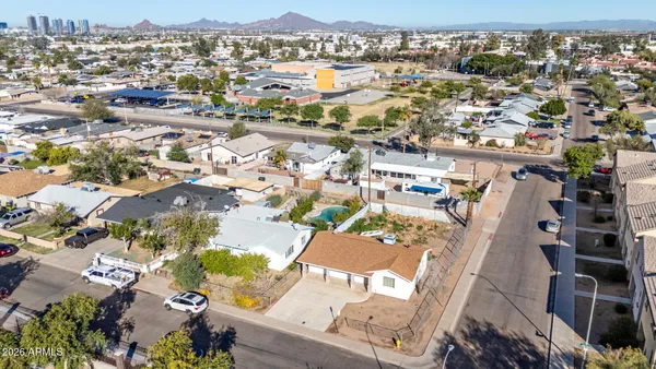 an aerial view of residential houses with outdoor space