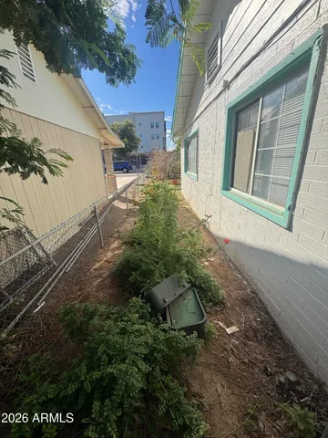 a view of a swimming pool with a yard