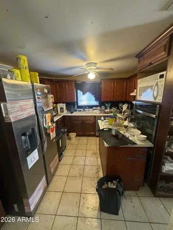 a kitchen with a stove and a refrigerator