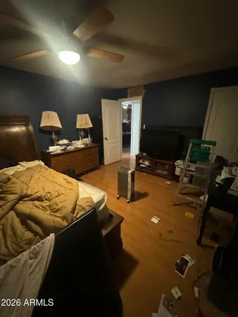 a bed room with a bed furniture and a flat screen tv