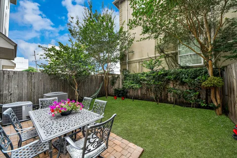 a view of outdoor dining space with a table and chairs
