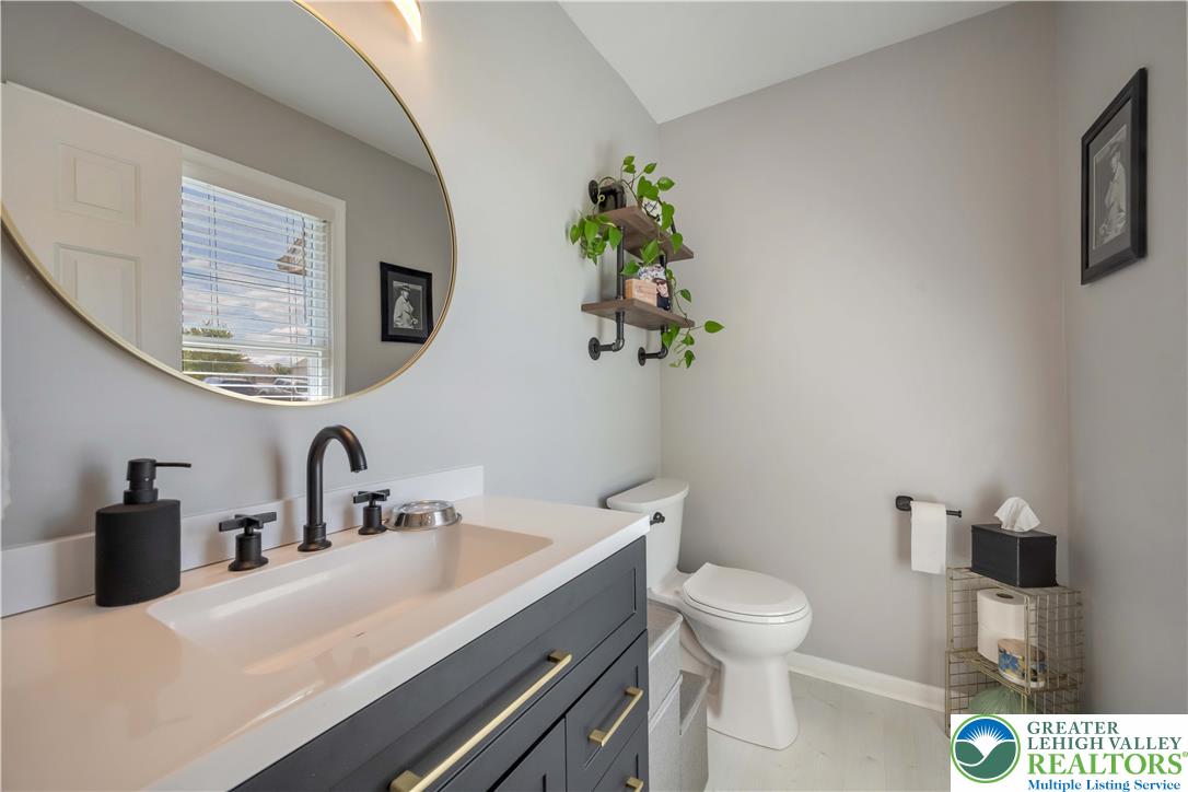 2448 Keeler Road Bath, PA 18014 - Photo 18 of 37 A well-appointed powder room features a sleek vanity and modern fixtures for convenience.