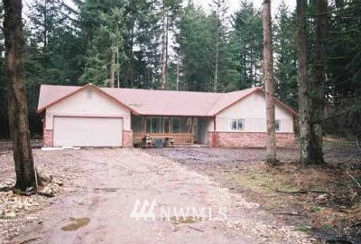 13244 Spindlewood Court Southwest Rochester, WA 98579 - Photo 1 of 1 a house with trees in the background
