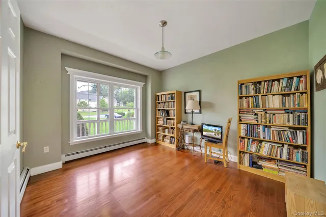 a view of a livingroom with furniture and workspace