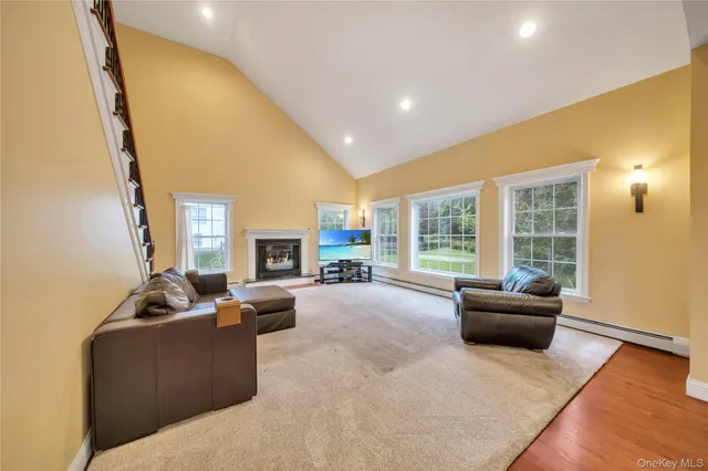a living room with furniture and a large window