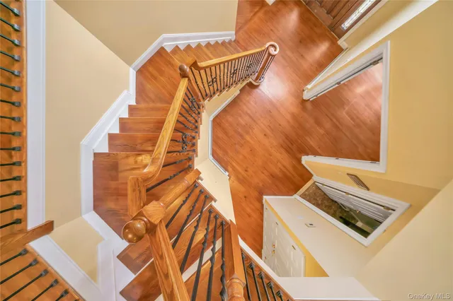 a view of an entryway with wooden floor