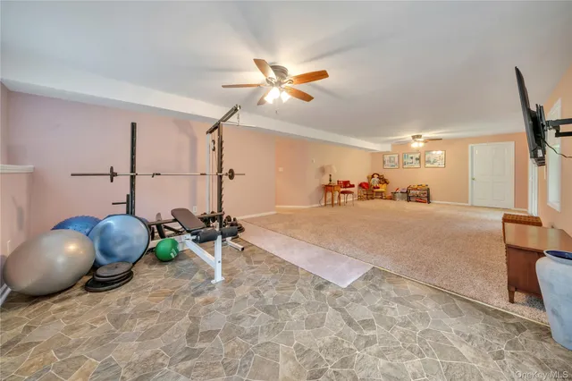 a view of a room with toys and a chandelier