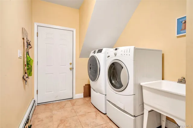 a view of a house with a big yard plants and large trees