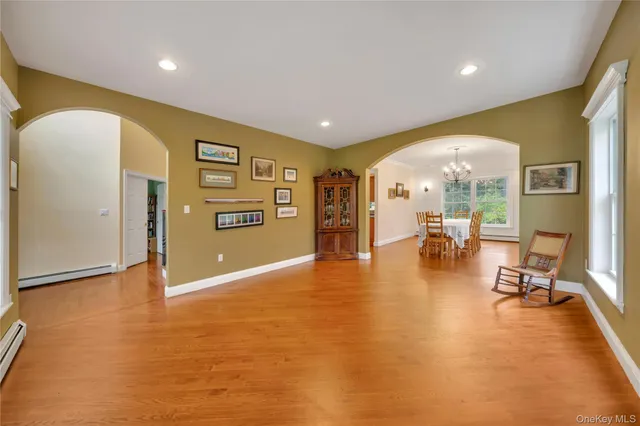 a view of a livingroom with furniture and a flat screen tv