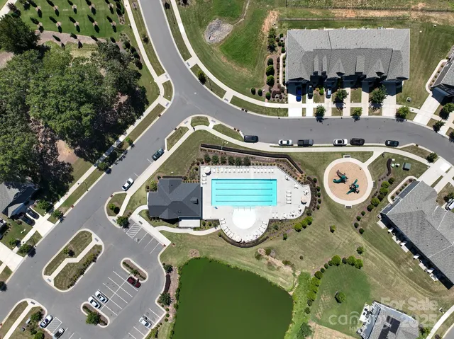 an aerial view of a house with a swimming pool