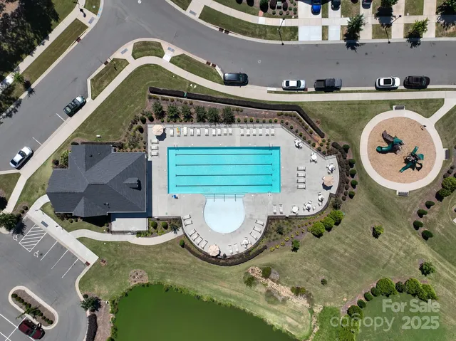an aerial view of a house with swimming pool