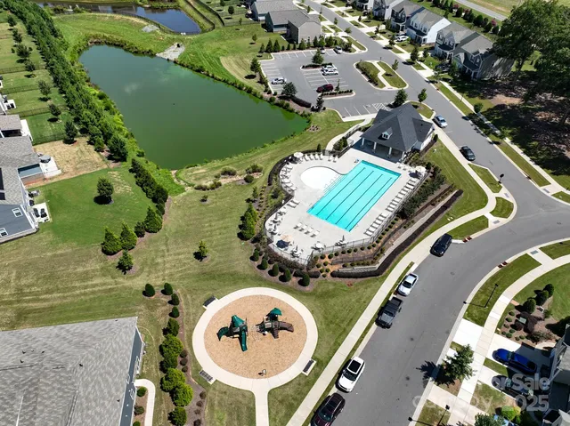 an aerial view of a house a swimming pool and outdoor space