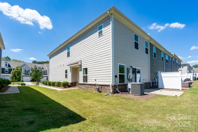 a front view of house with yard and outdoor seating