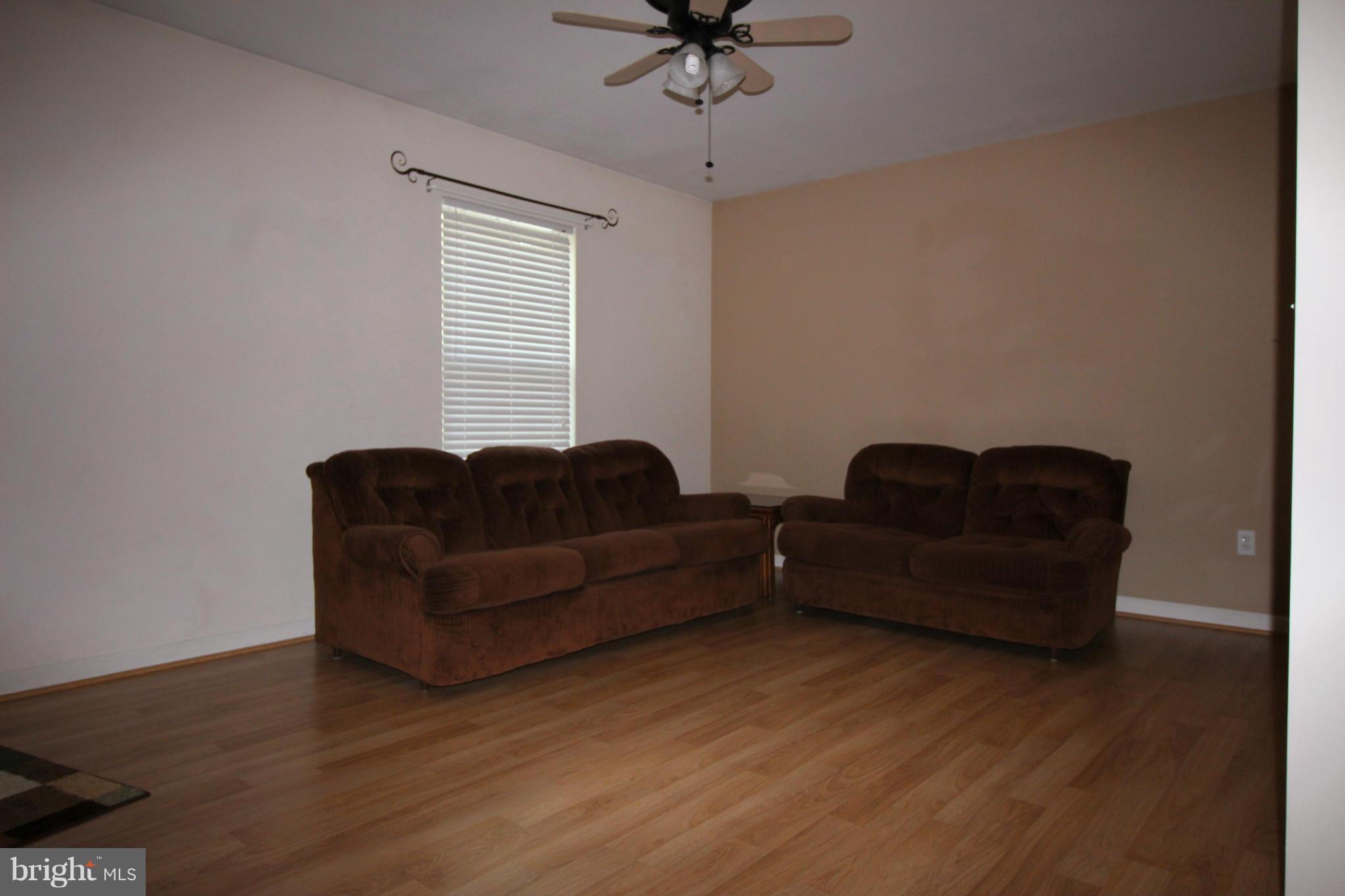 246 Windjammer Road Ocean Pines, MD 21811 - Photo 13 of 30 a living room with furniture and a window
