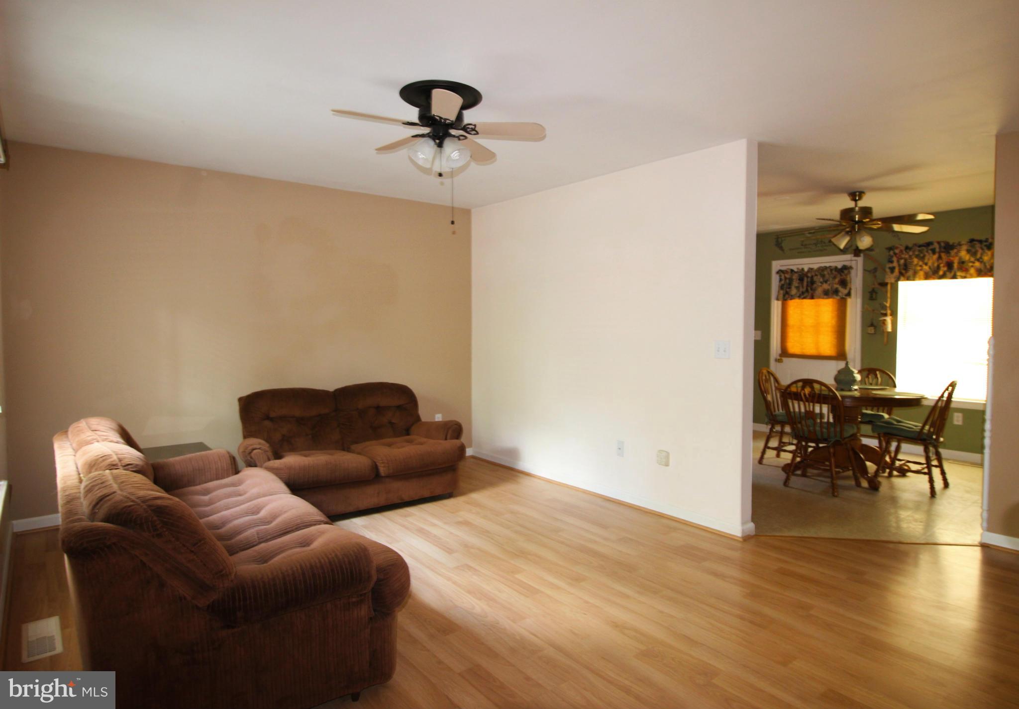 246 Windjammer Road Ocean Pines, MD 21811 - Photo 14 of 30 a living room with furniture and a wooden floor
