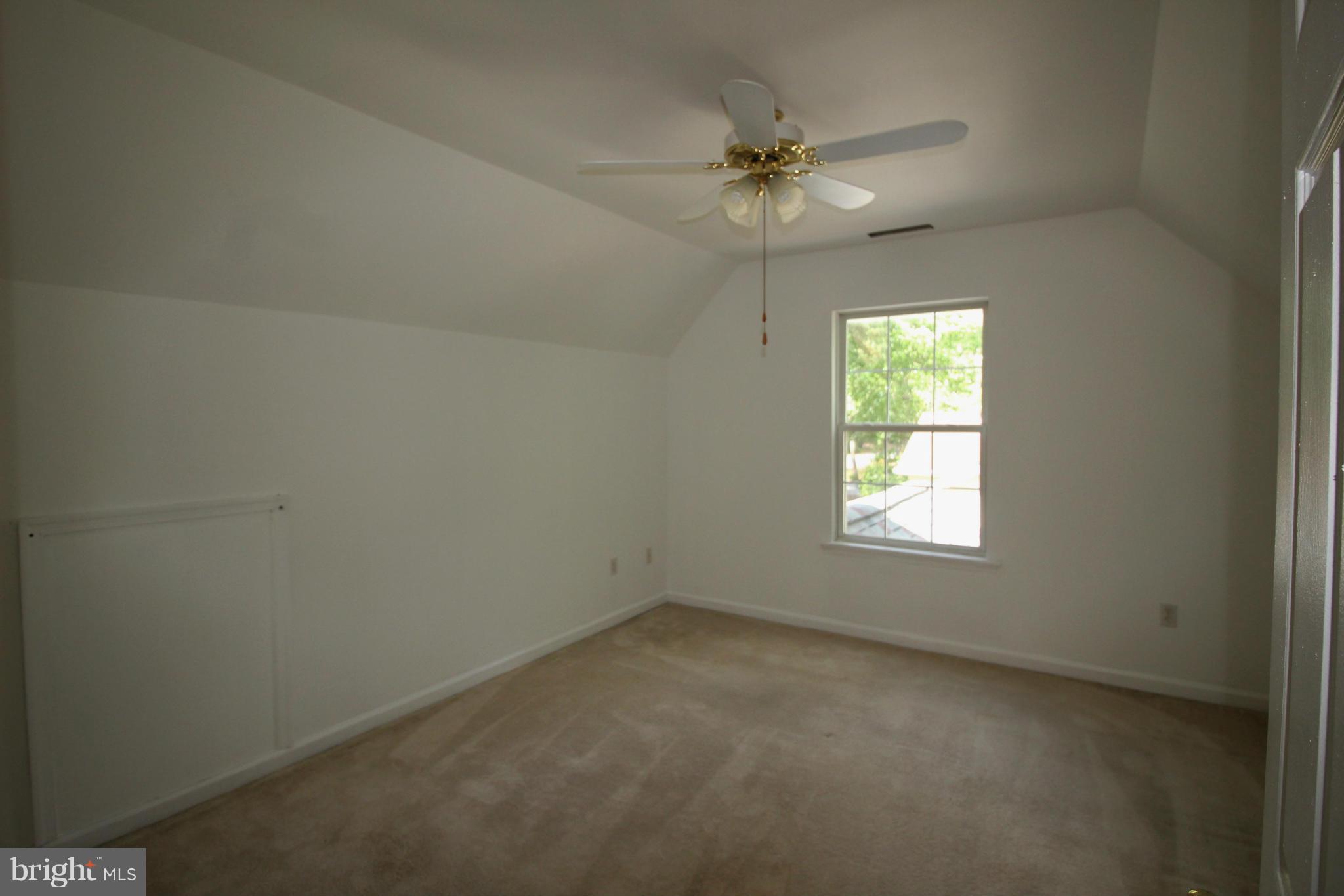246 Windjammer Road Ocean Pines, MD 21811 - Photo 22 of 30 an empty room with a window and a fan
