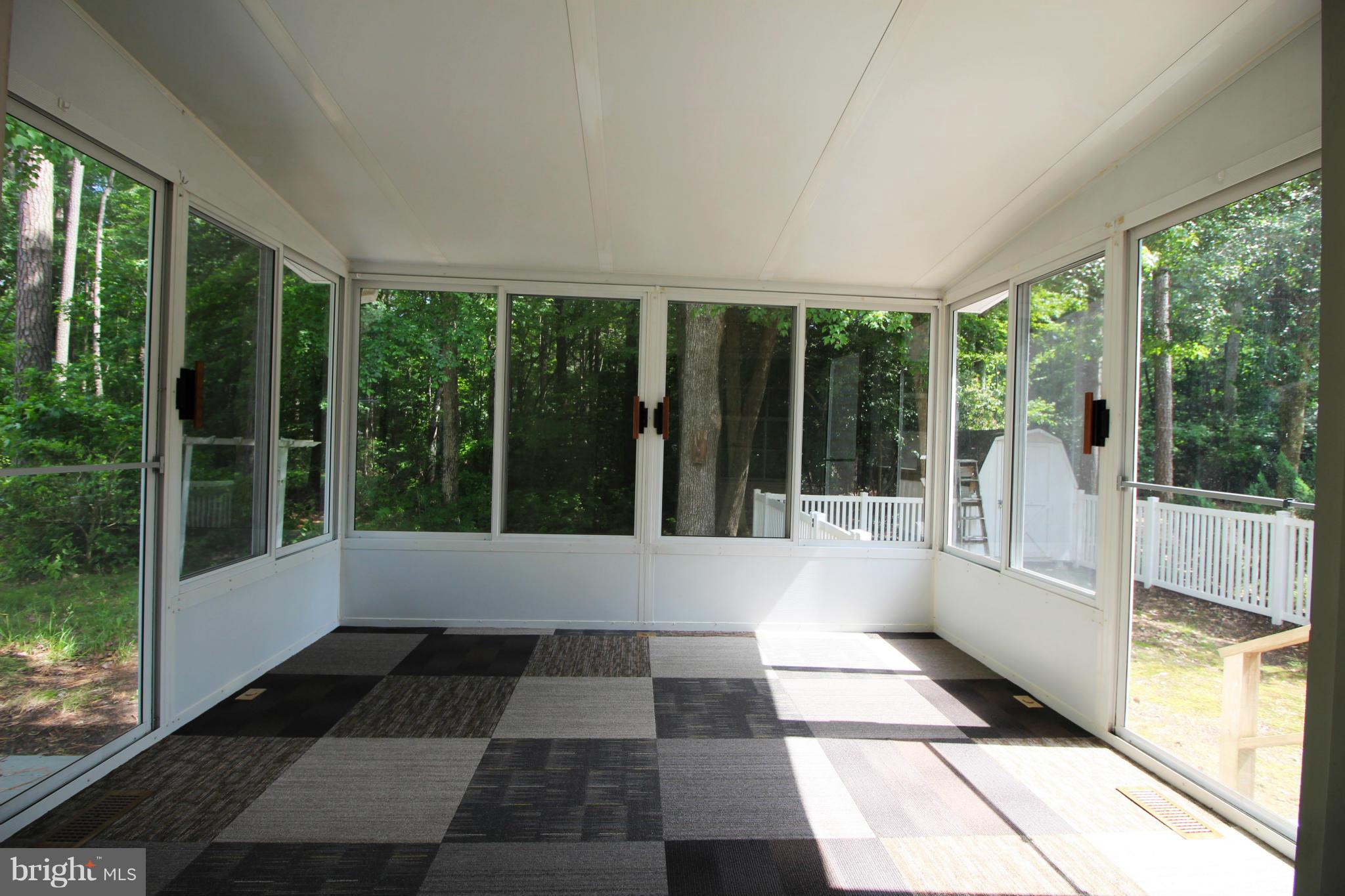 246 Windjammer Road Ocean Pines, MD 21811 - Photo 24 of 30 a view of a black and white floor with a large window