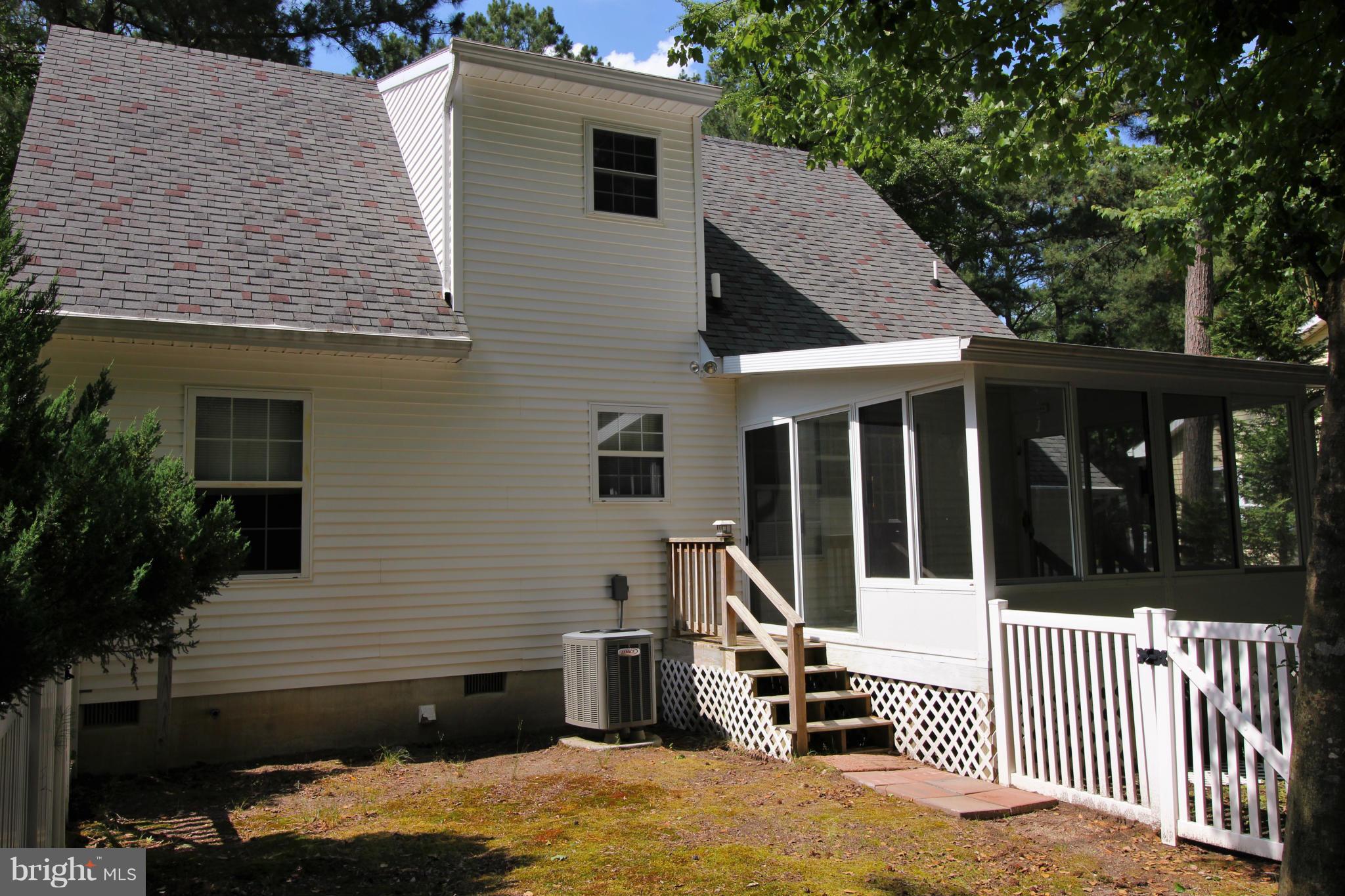 246 Windjammer Road Ocean Pines, MD 21811 - Photo 26 of 30 a view of a house with a yard