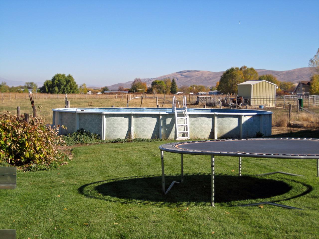 3201 Wiley Road Yakima, WA 98903 - Photo 8 of 8 a view of a house with a yard and furniture
