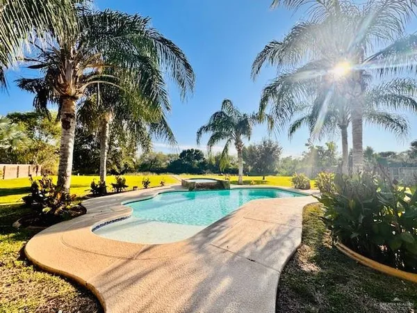 a view of a yard and lake
