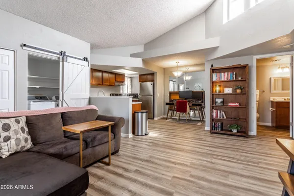 a living room with furniture and a flat screen tv